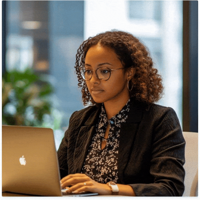 gif of a lady with glasses using a laptop