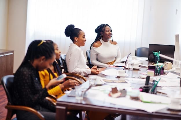 Ladies in a boardroom with some papers on the table