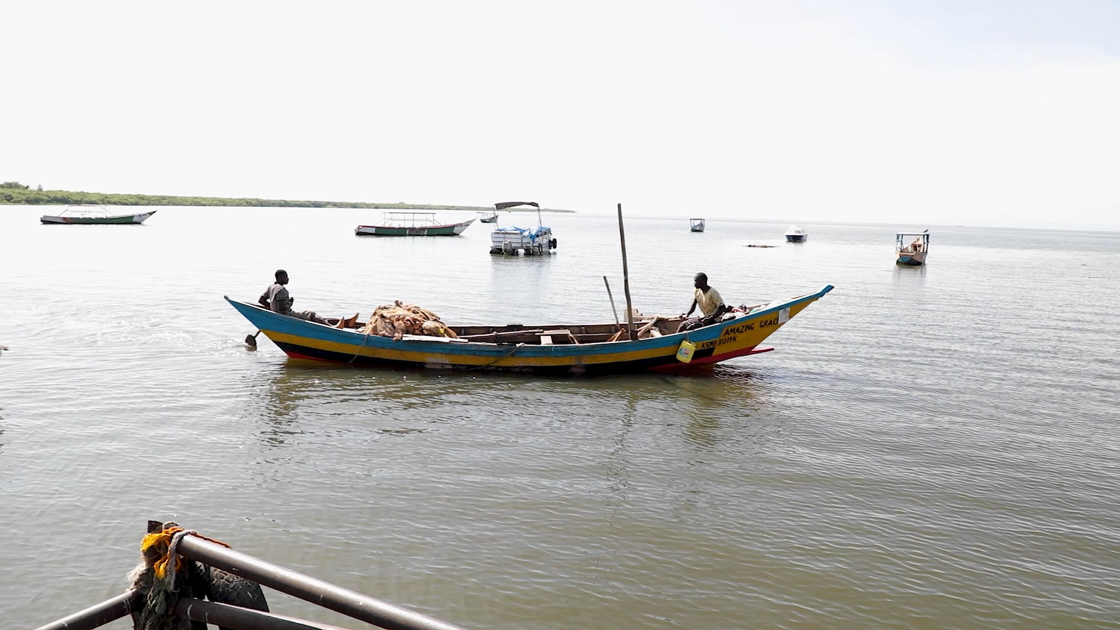 an image of fishing boats in a lake