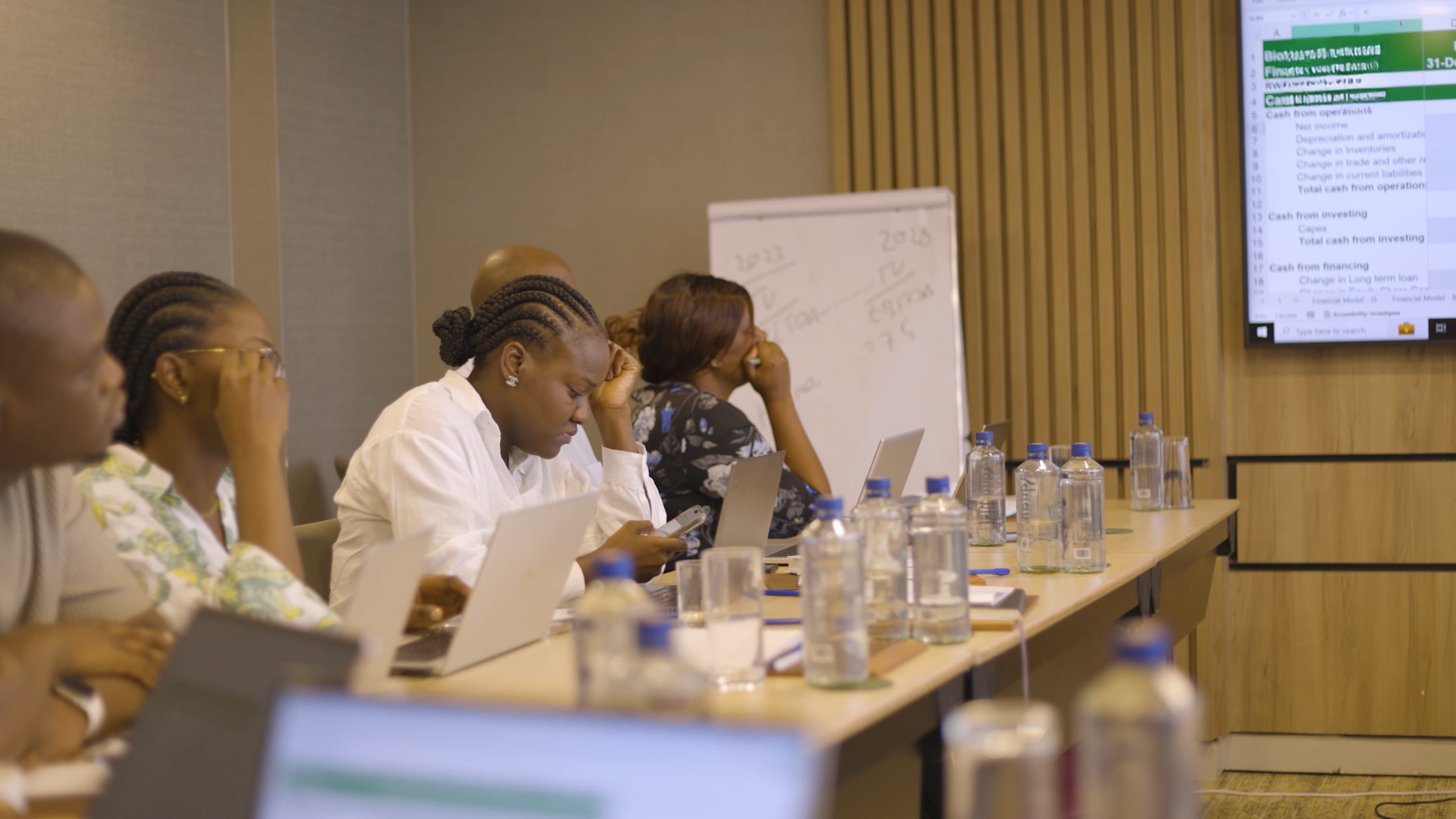 an image of two ladies seated in a meeting room